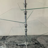 A pair of vintage side tables in glass and chrome metal.