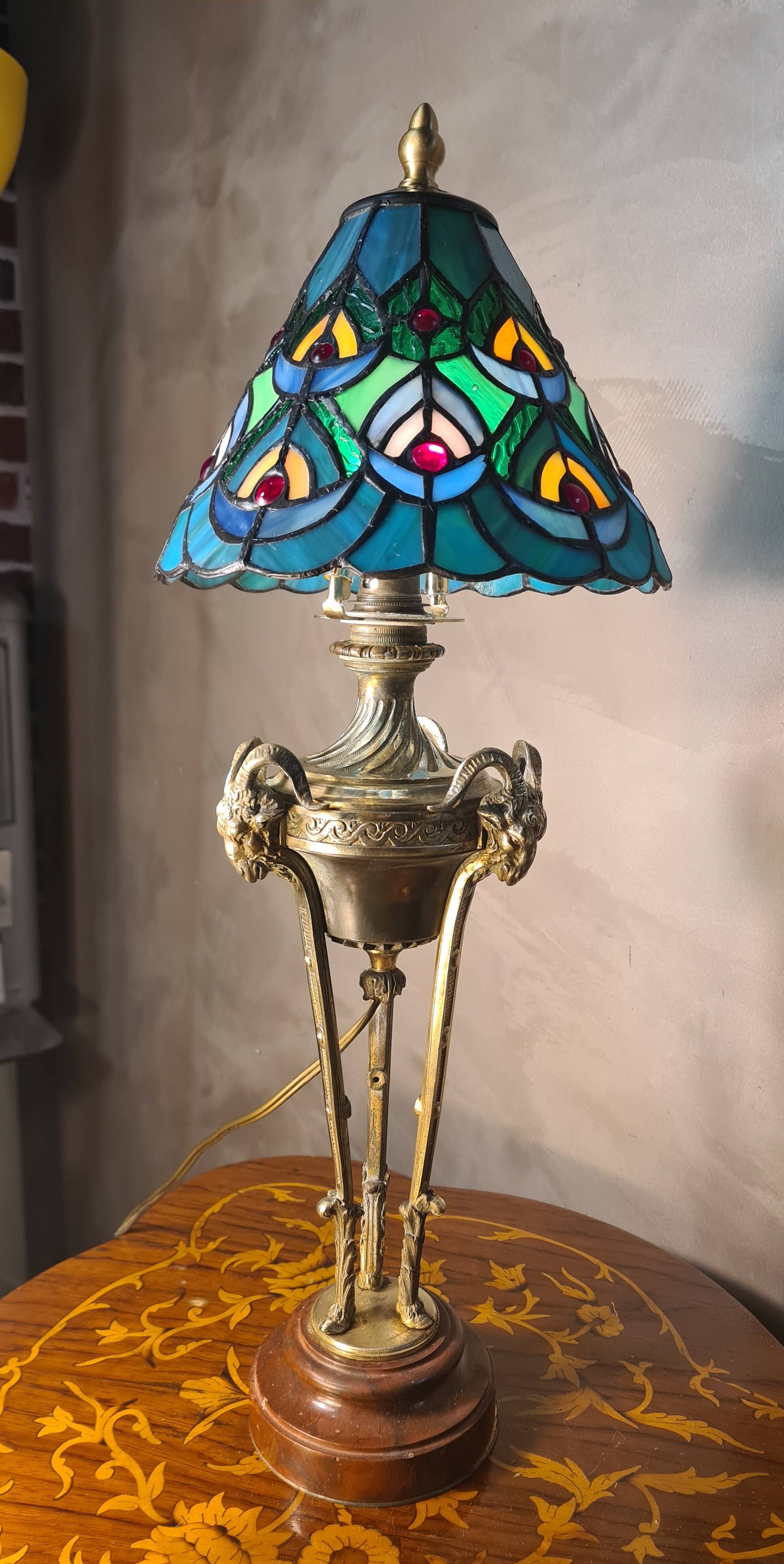 bronze lamp with a goat's head from the 19th century and a stained glass lampshade soldered with lead