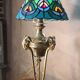 bronze lamp with a goat's head from the 19th century and a stained glass lampshade soldered with lead