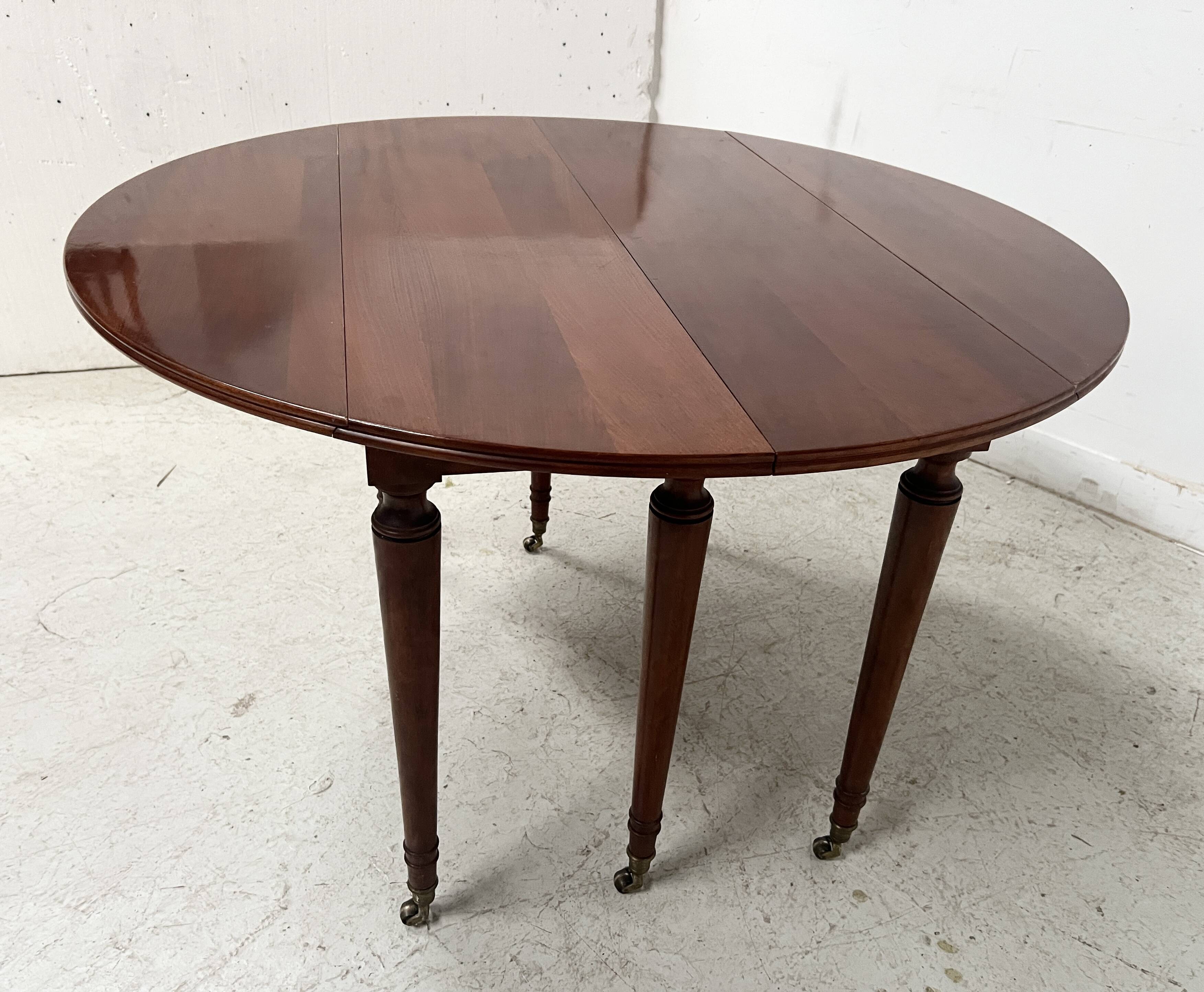 A six-foot Louis XVI style mahogany table from the 19th century.