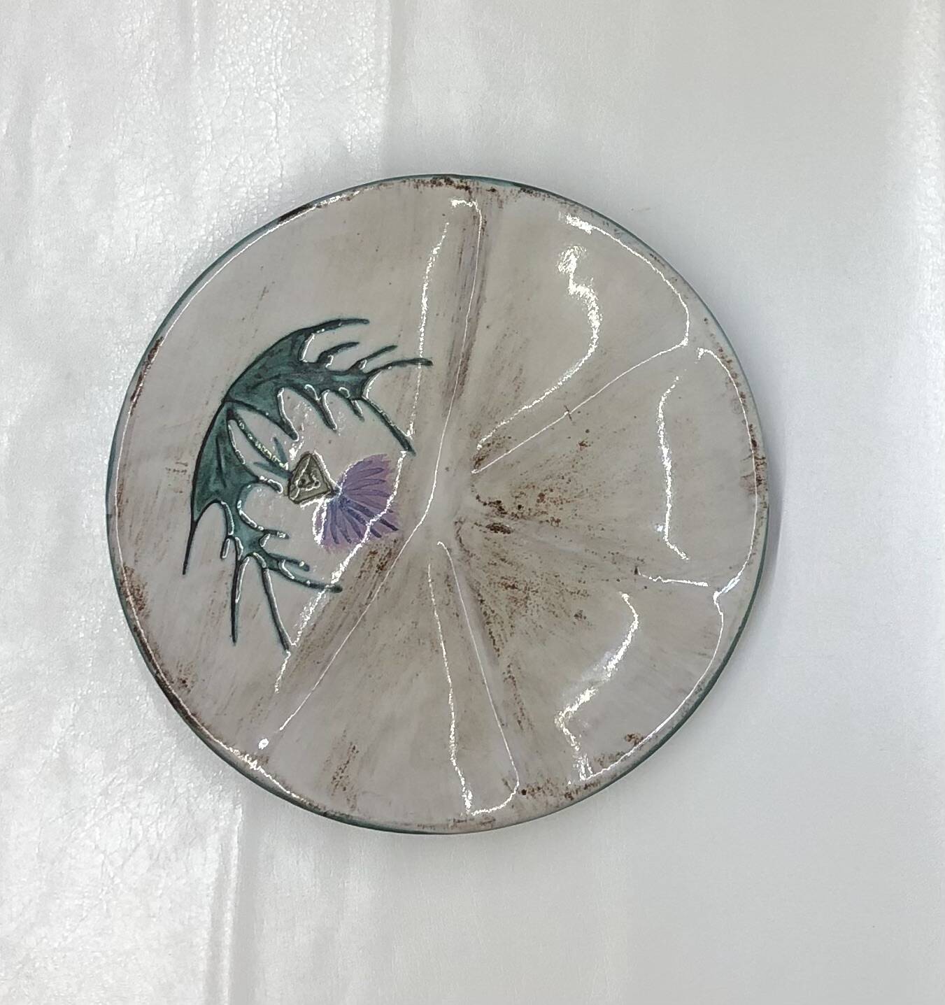 Thistle-themed decorative plate by Daniel Étienne in Vallauris