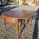 12-foot round oak table with 7 extensions / 20 people
