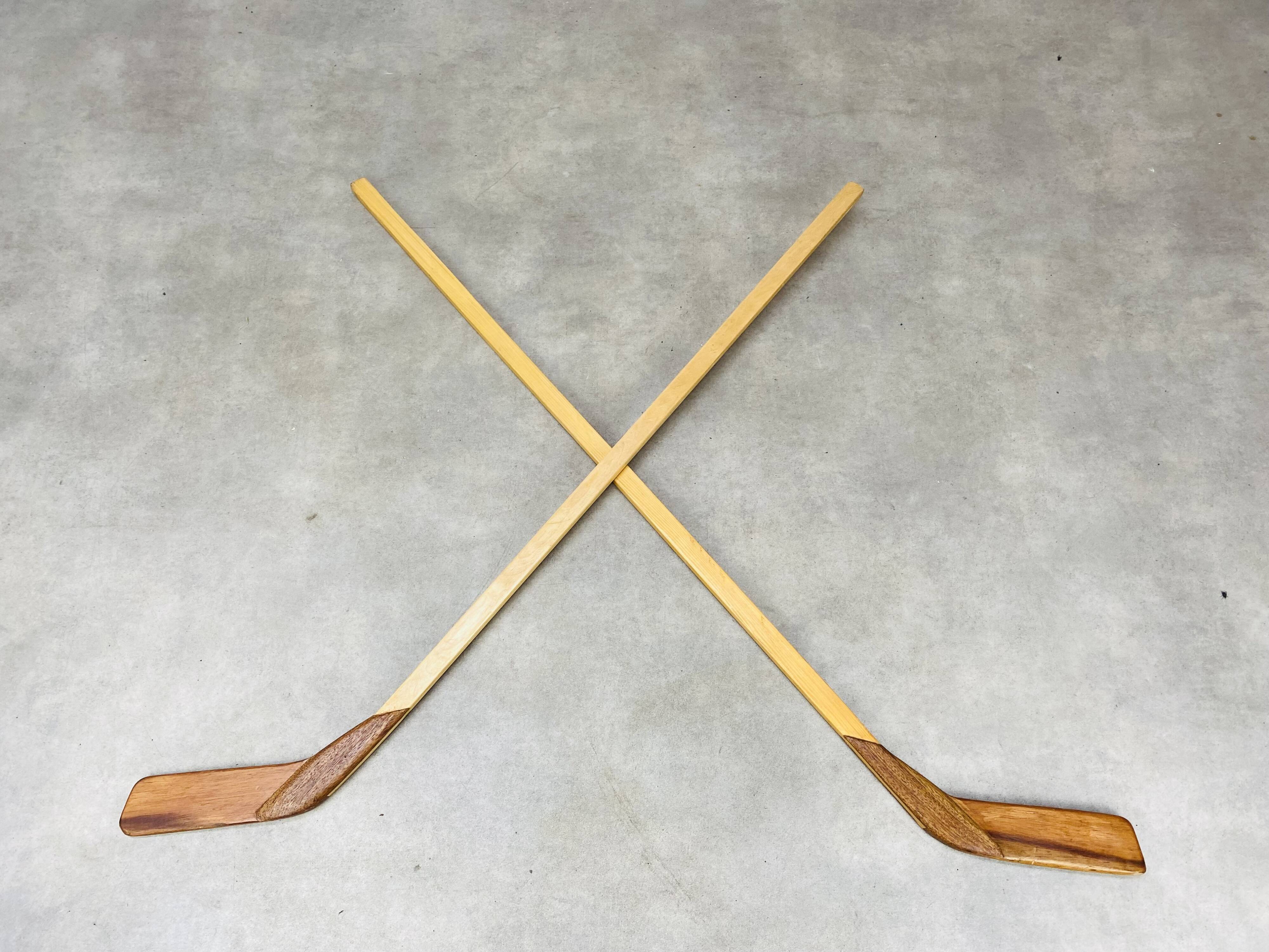 Pair of vintage wood hockey sticks