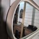 Oval mirror in white lacquer from the 1970s.
