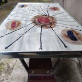 Coffee table with ceramic top.