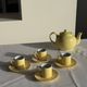 Set of 4 vintage yellow Italian espresso cups and saucers.