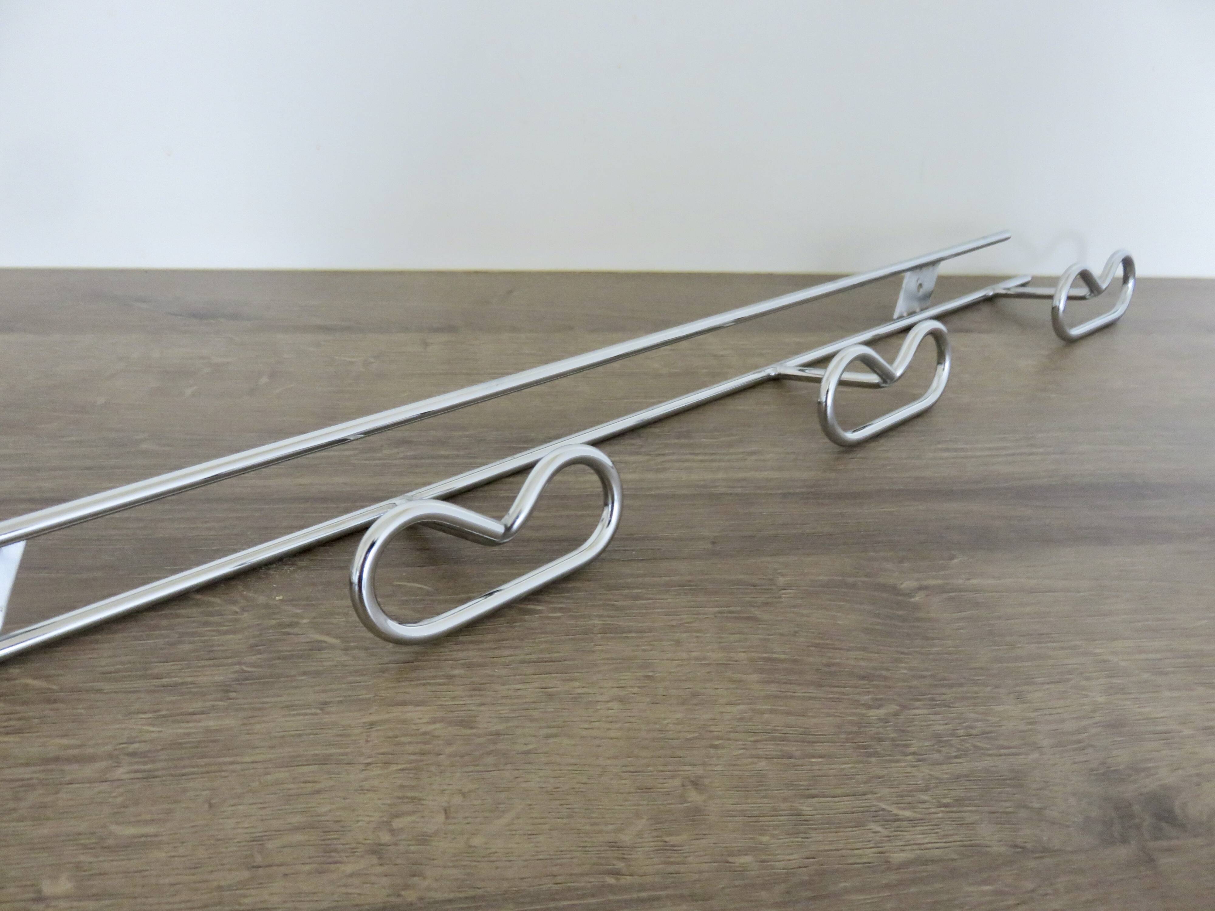 Large vintage wall-mounted coat rack in chrome metal
