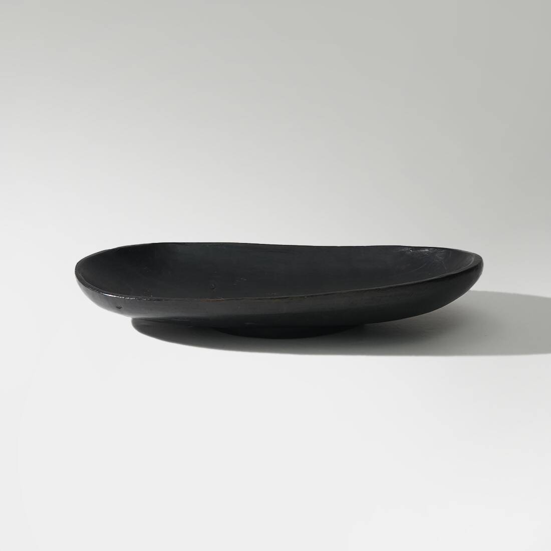 Organic shaped black wooden bowl, 1960s