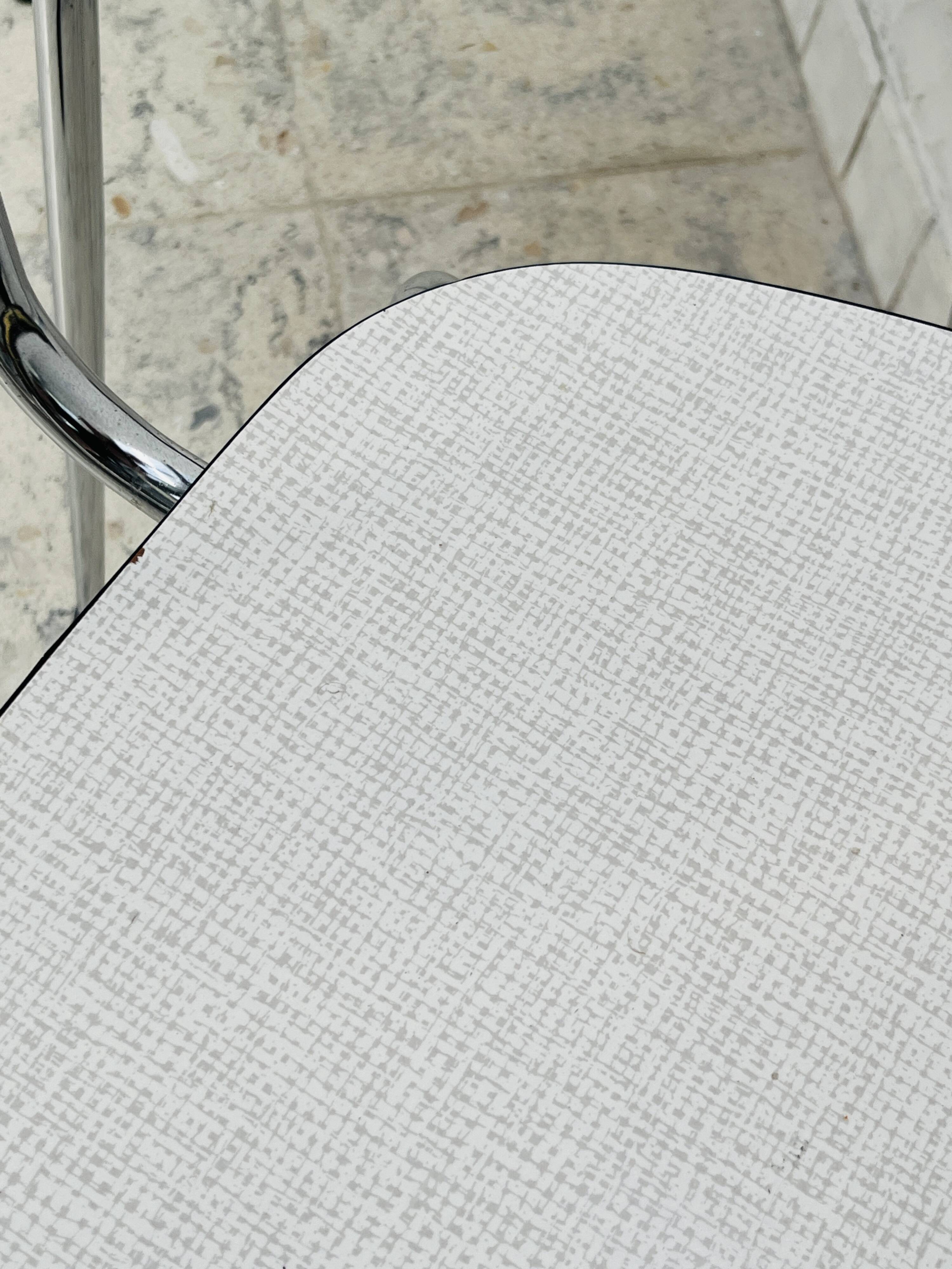 Set of two vintage grey Formica and chrome chairs.