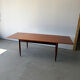 Rectangular extendable dining table with Scandinavian design in teak.