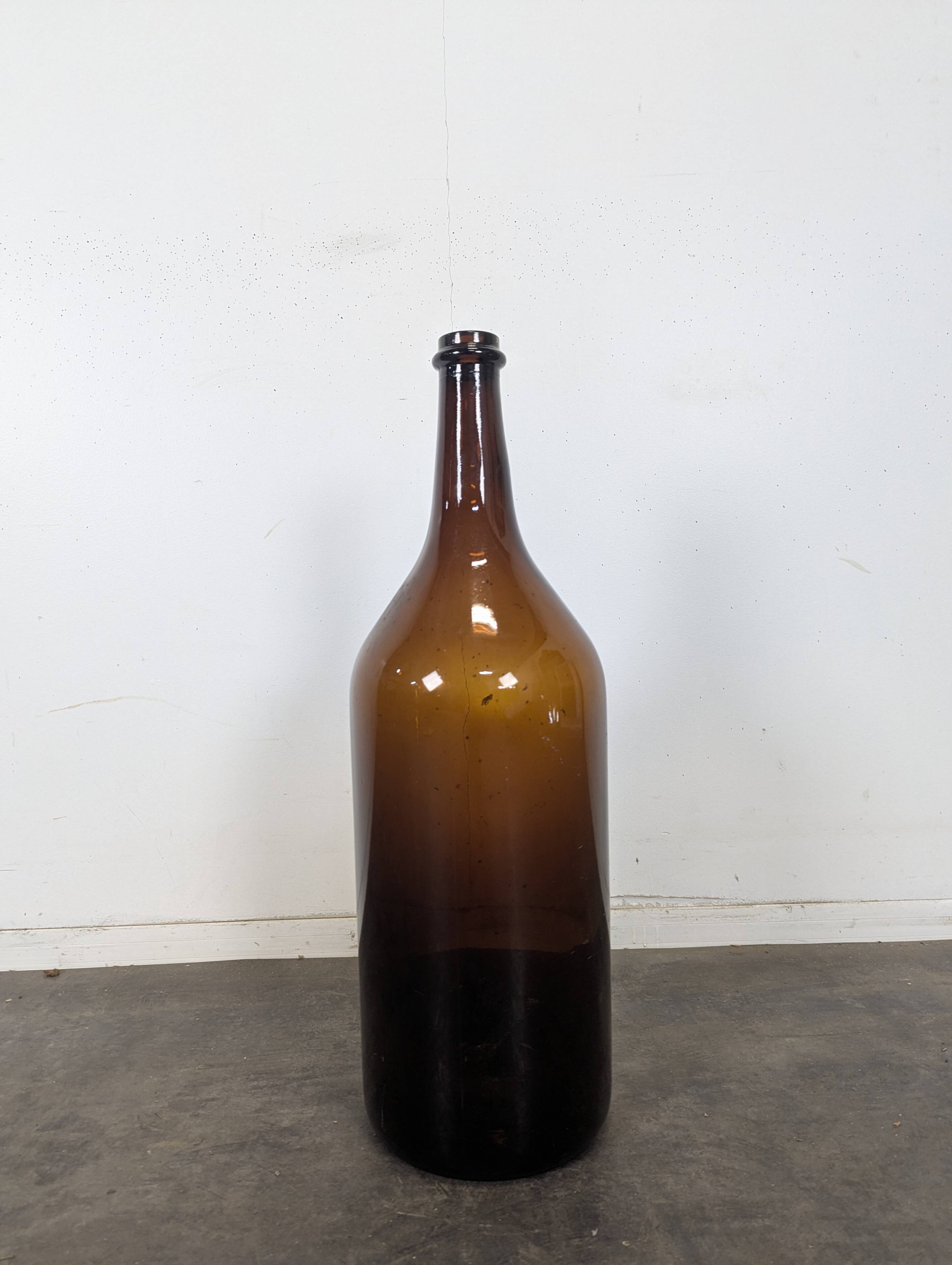 Large antique blown amber glass bottle