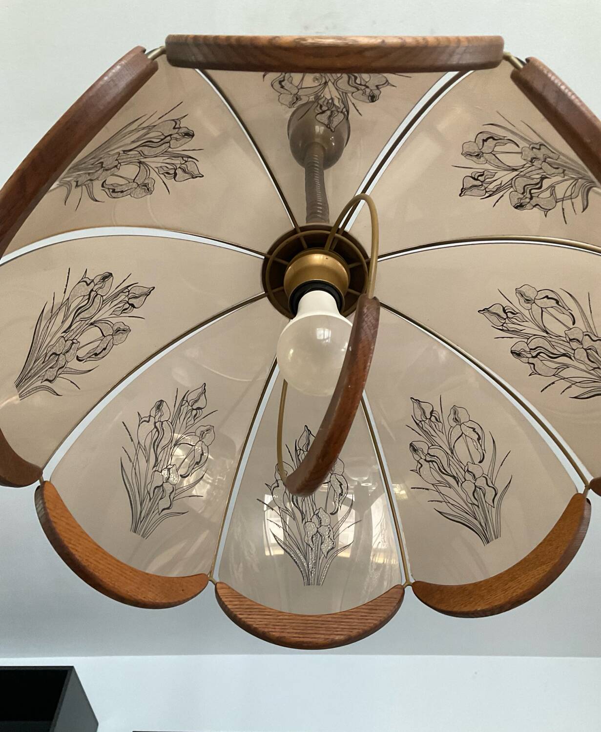 Scandinavian style glass and wood pendant light.