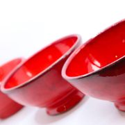Set of 3 bright red enamelled earth bowls made in France