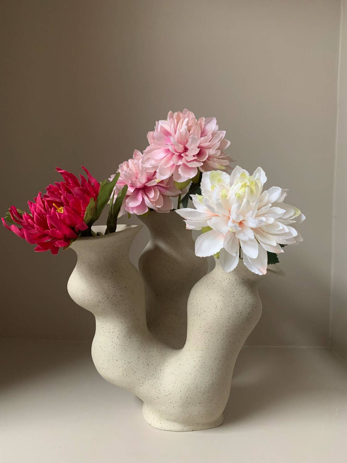 Organic-shaped vase in pyritic stoneware.