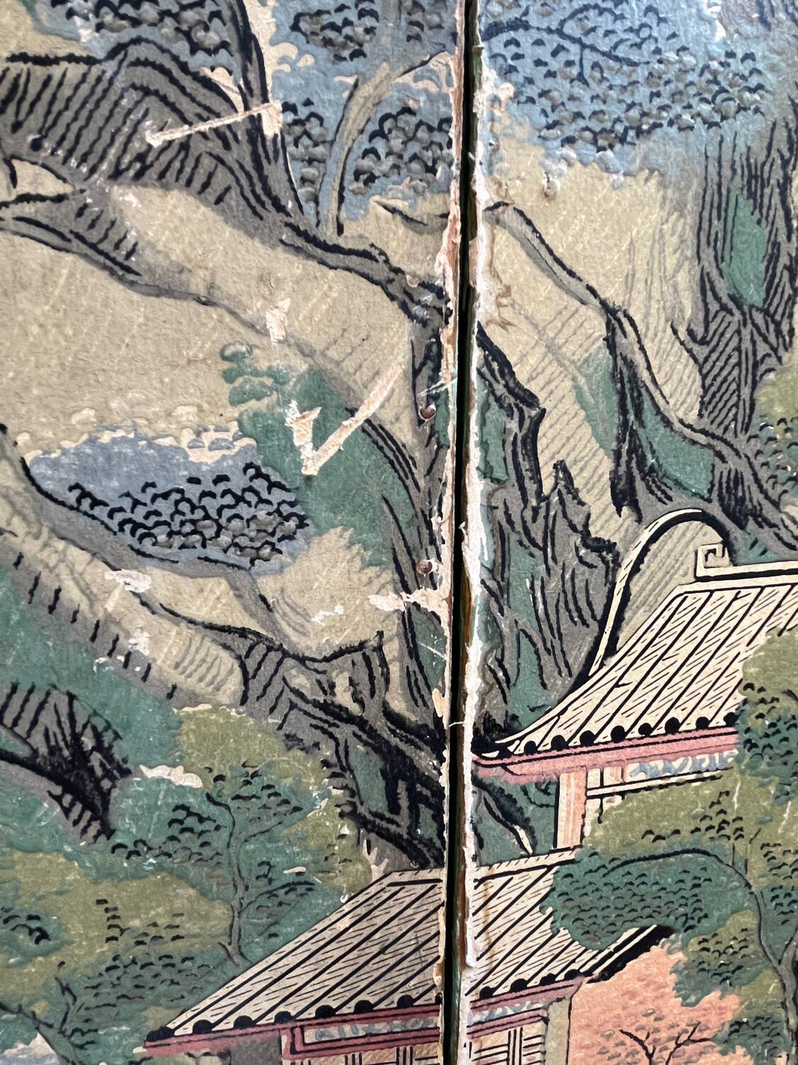 Wooden screen in Asian style, covered with Chinese wallpaper.