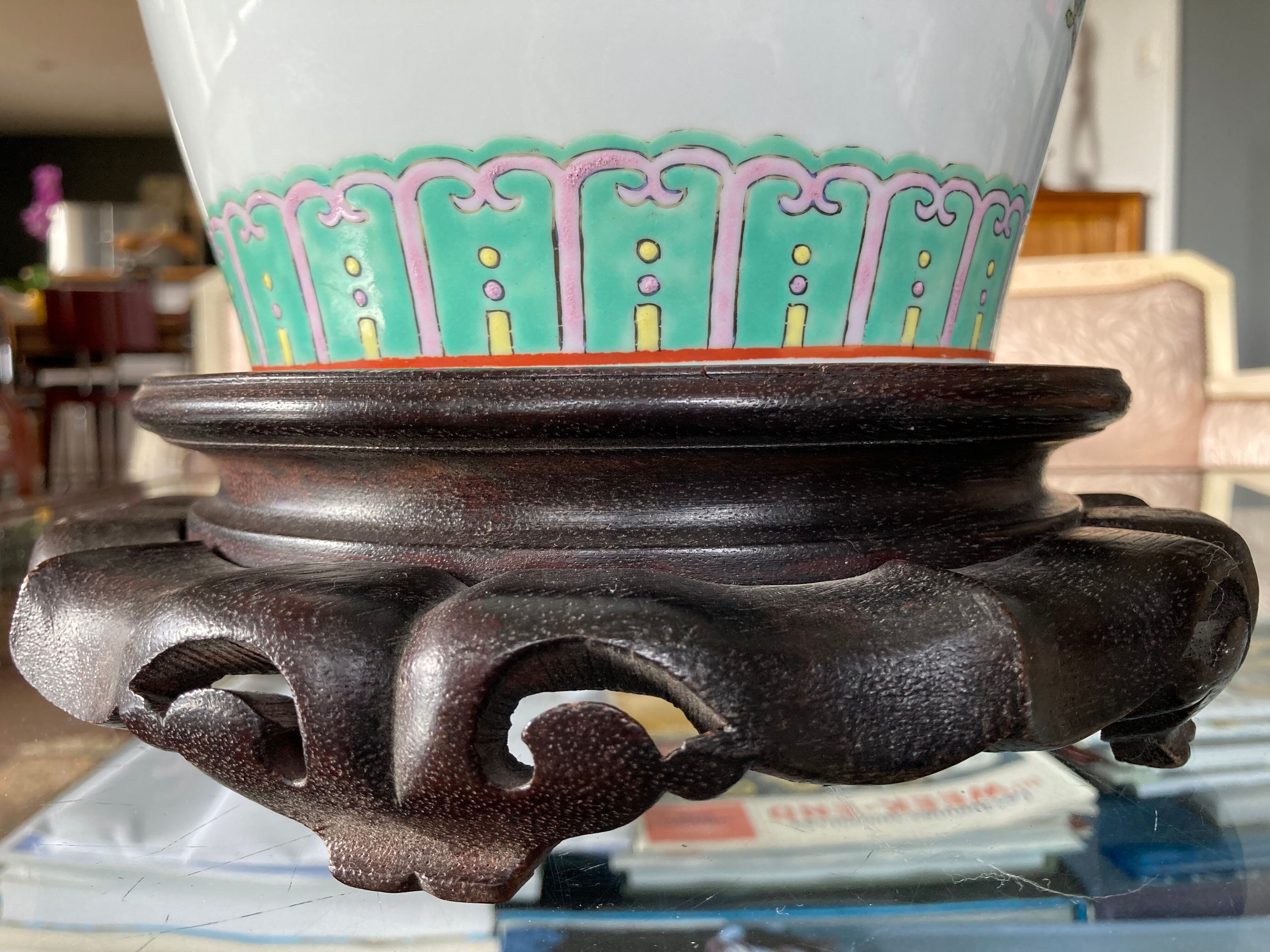 Chinese vase on wooden base