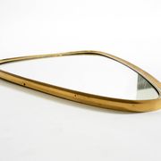 Heavy mid-century brass kidney-shaped wall mirror from Münchner Zierspiegel