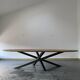 Oval table in solid oak refined edges with central foot in black metal