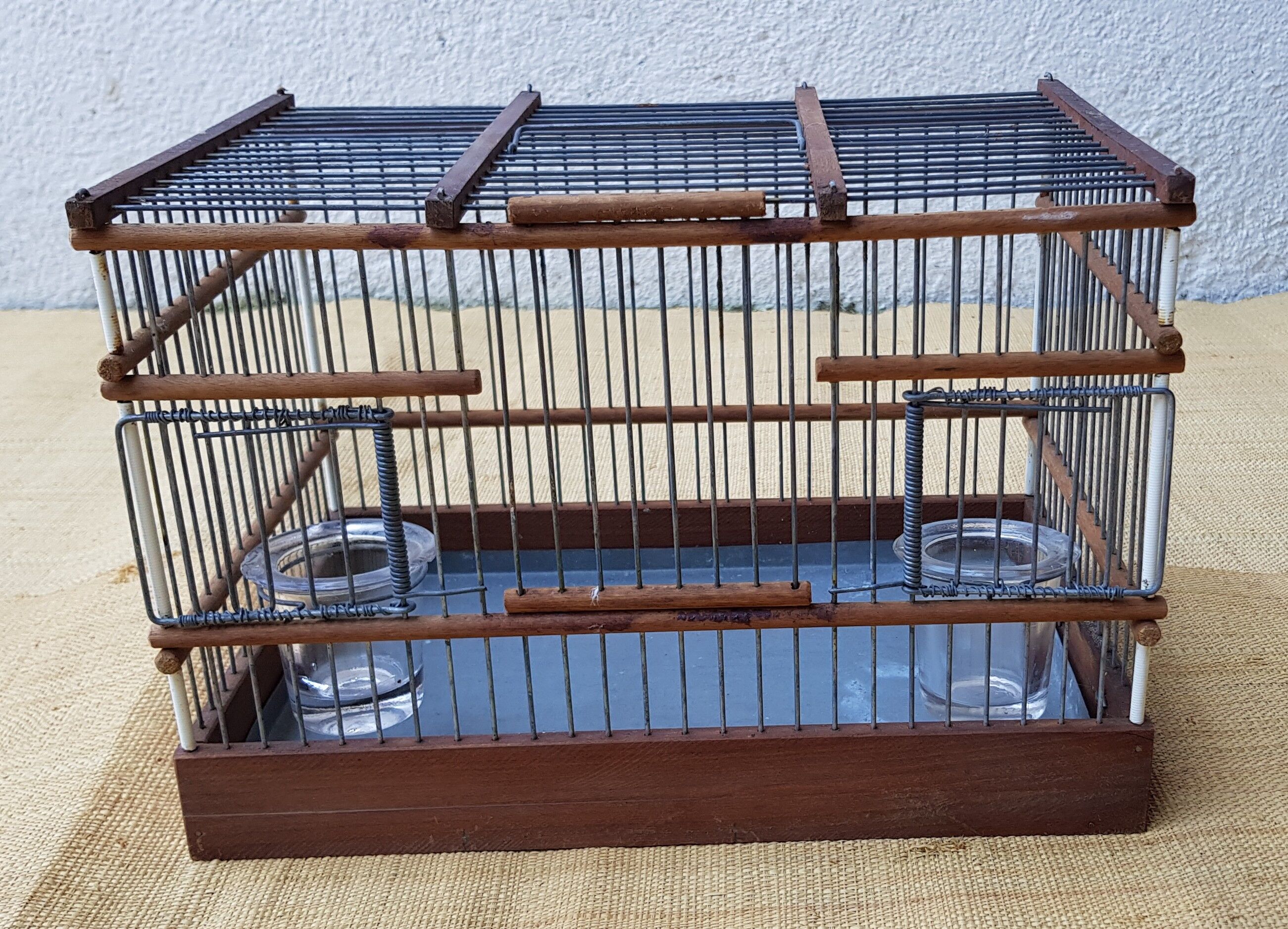 Birdcage with glass trough