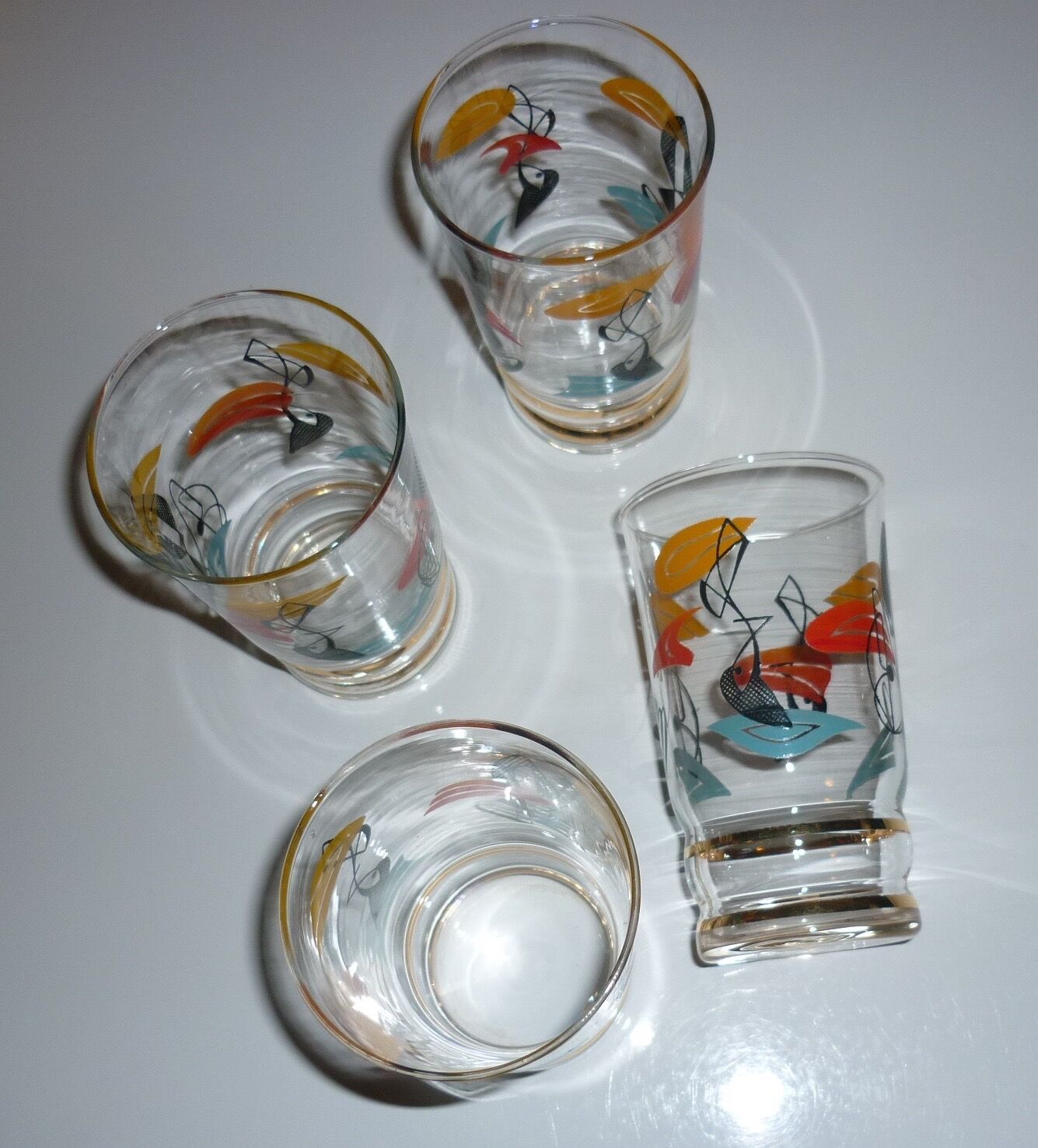 4 juice/water patterns fish colors and gold edges