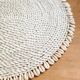 Large woven vegetable fiber placemat decorated with shells cowrie shells Bali