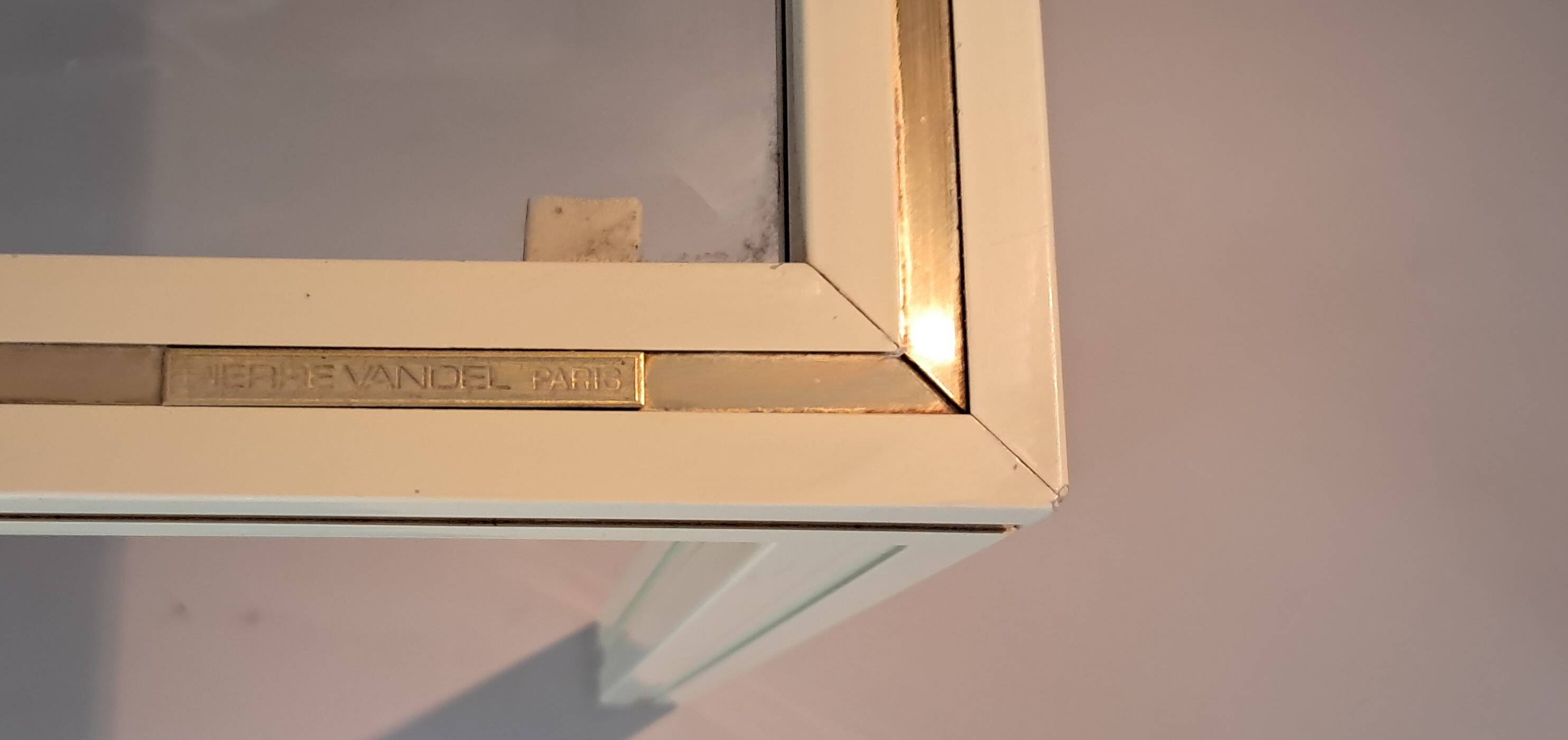 White lacquered side table by Pierre Vandel with gold brass.