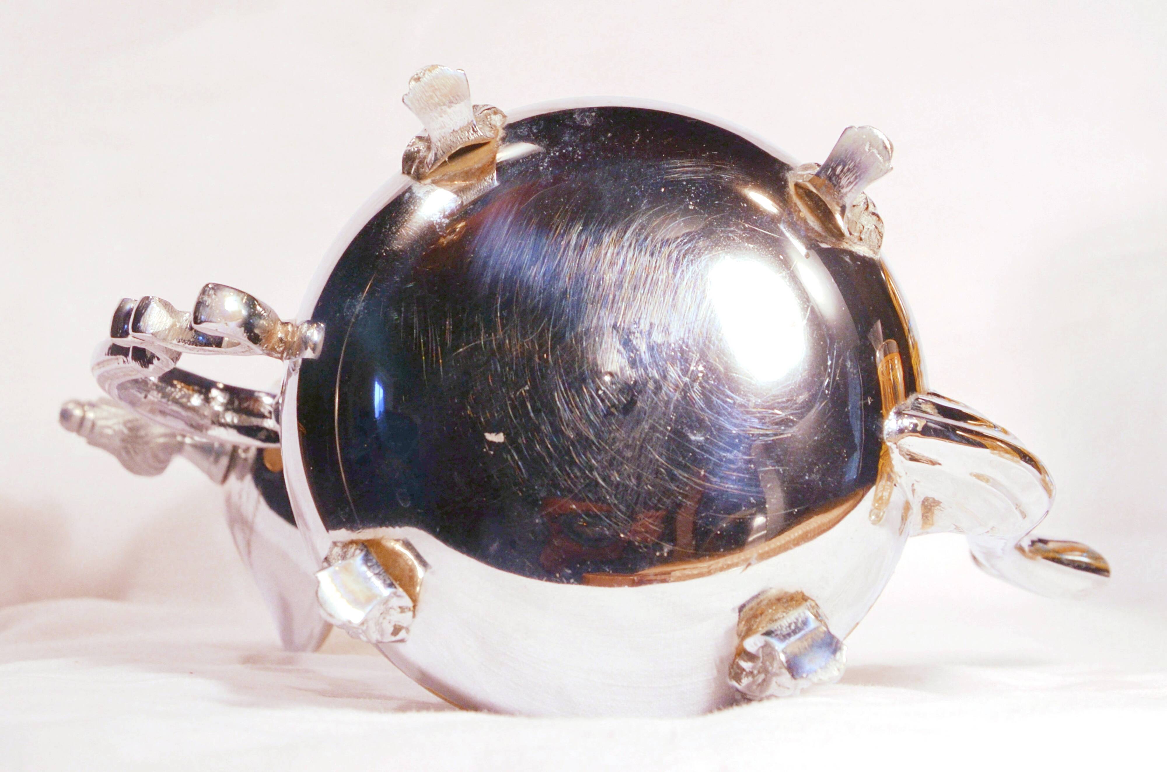 Oriental teapot in chrome metal and brass, 12x19cm