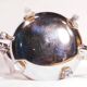 Oriental teapot in chrome metal and brass, 12x19cm