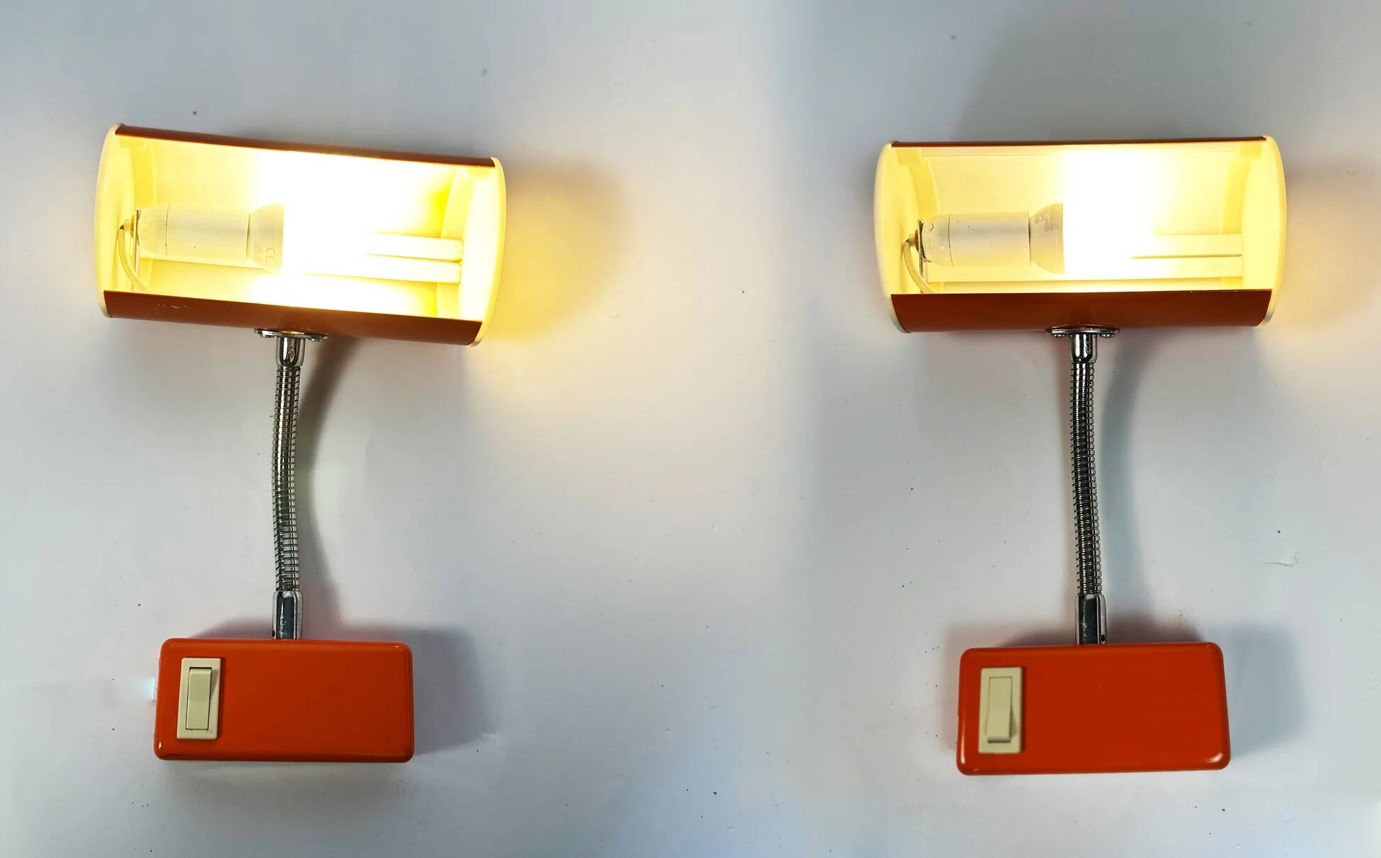 Pair of orange wall sconces from the 1970s by Ateljé Lyktan.