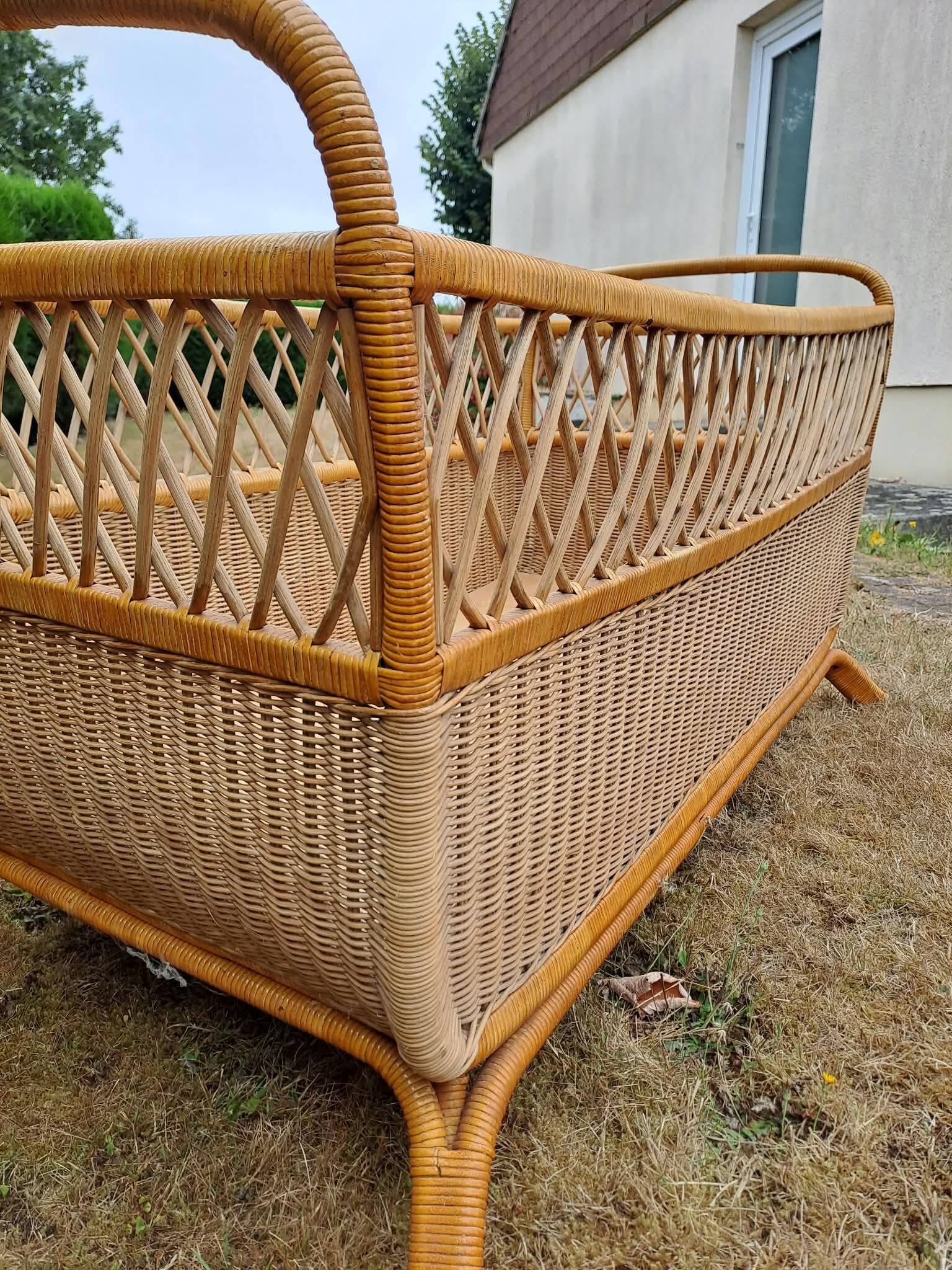 Rattan cradle.