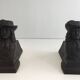 Pair of cast iron andirons in the likeness of a musketeer