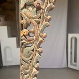 Indonesian construction element in carved wood with intertwined plant motifs mounted on a base (fri