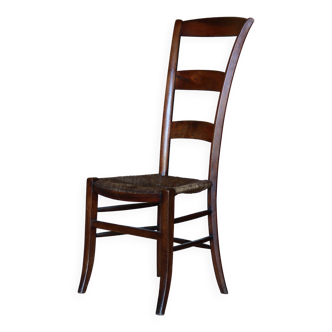 Old wooden and straw nurse's chair