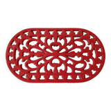 Red enamelled cast iron trivet