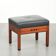 Ottoman en cuir noir au design Art Déco