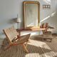 Reclining armchair in natural wood and woven rattan