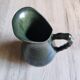 Vintage ceramic pitcher vase in glazed green and blue.