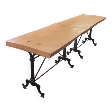 Large bistro table with a wooden top and cast iron legs - 2m56