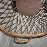 Cradle of doll in rattan on wheels