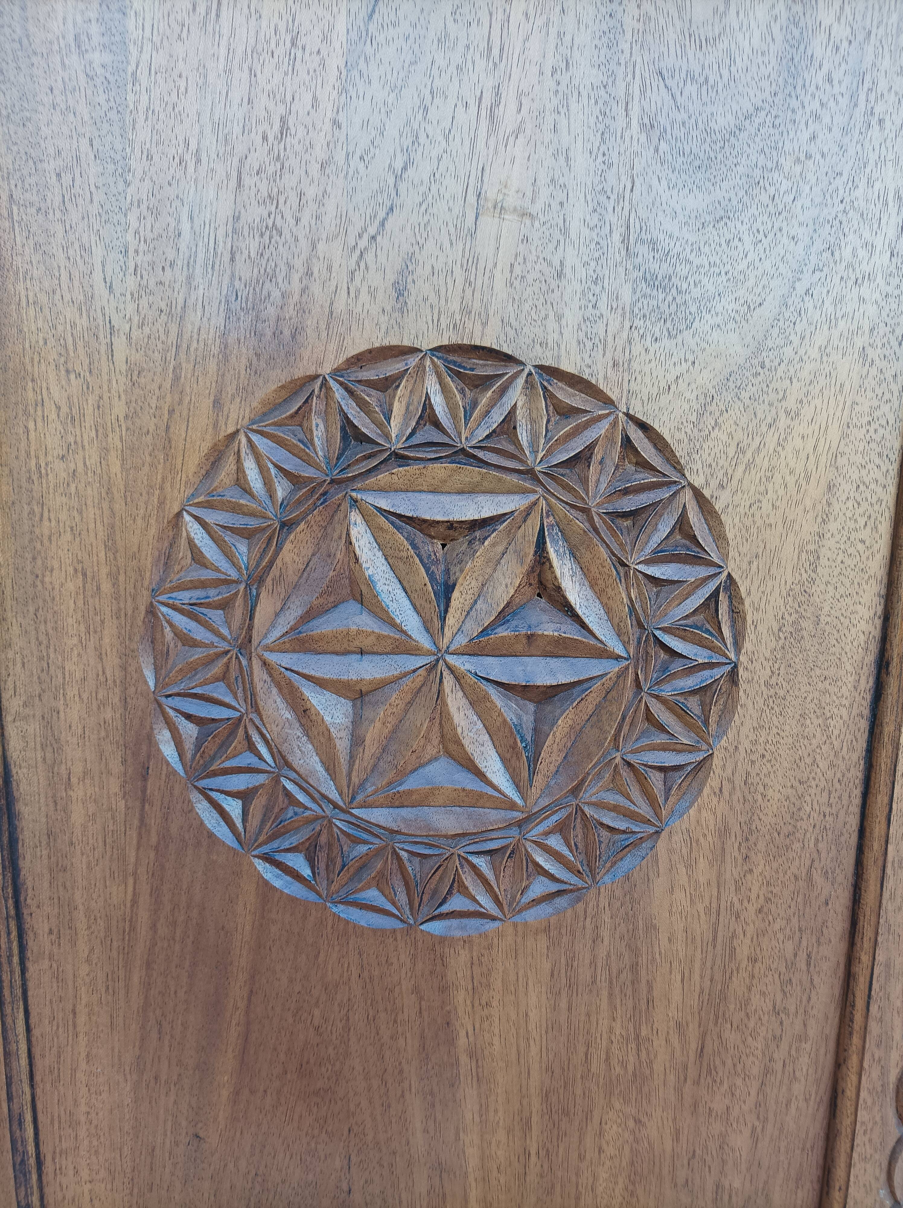 Corner cabinet in carved walnut, Savoyard style.