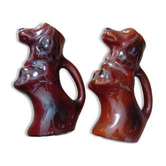 Set of two slipware jugs in the shape of a dog.
