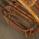 Vintage wicker armchair with magazine rack, Italy, 1960s