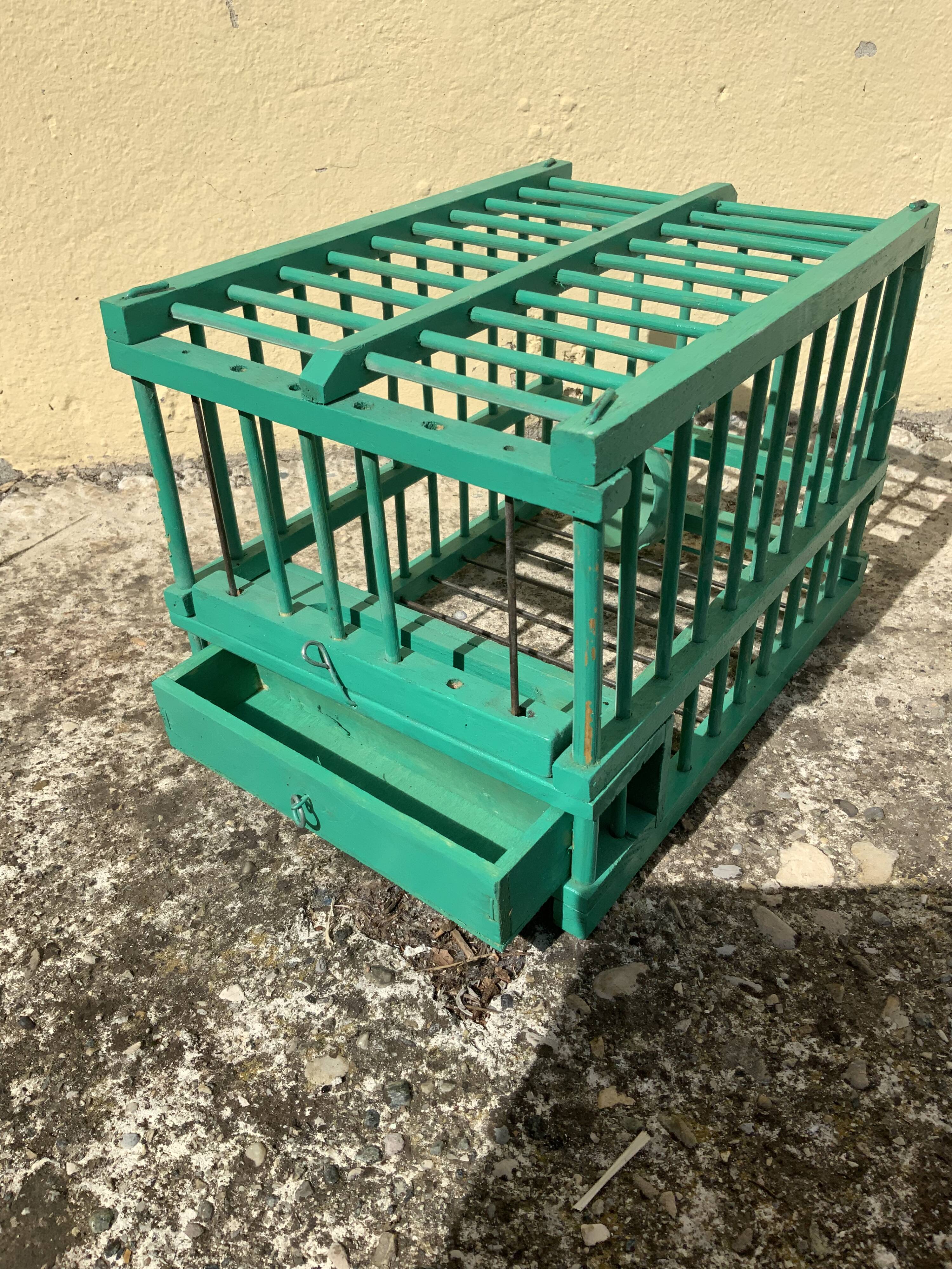 Vintage bird cage in green wood retro paint
