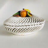 Covered basket in woven ceramic and fruit slip.