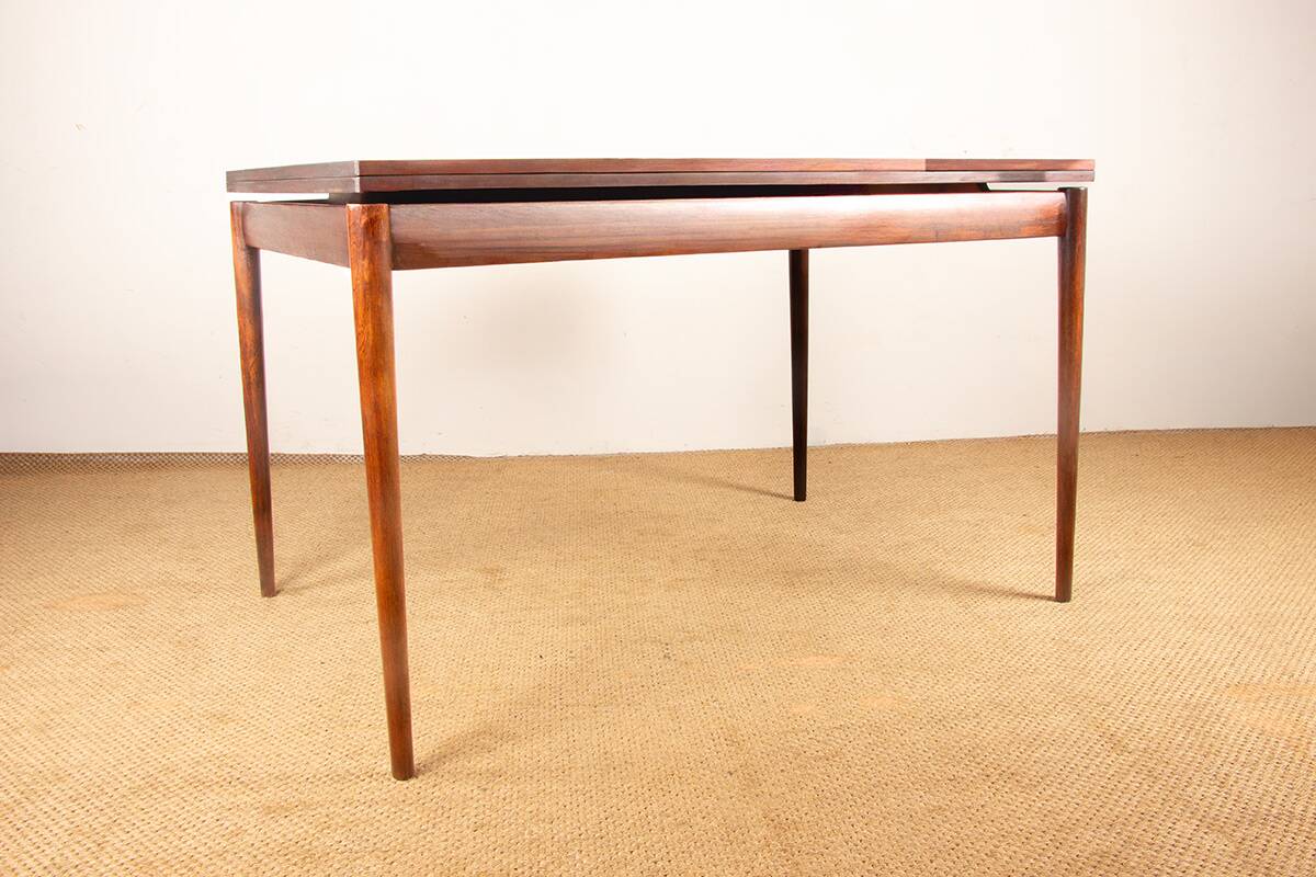 Danish extendable dining table in rosewood and brass by Poul Volther