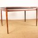 Danish extendable dining table in rosewood and brass by Poul Volther