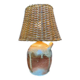 Table lamp in stoneware and rattan