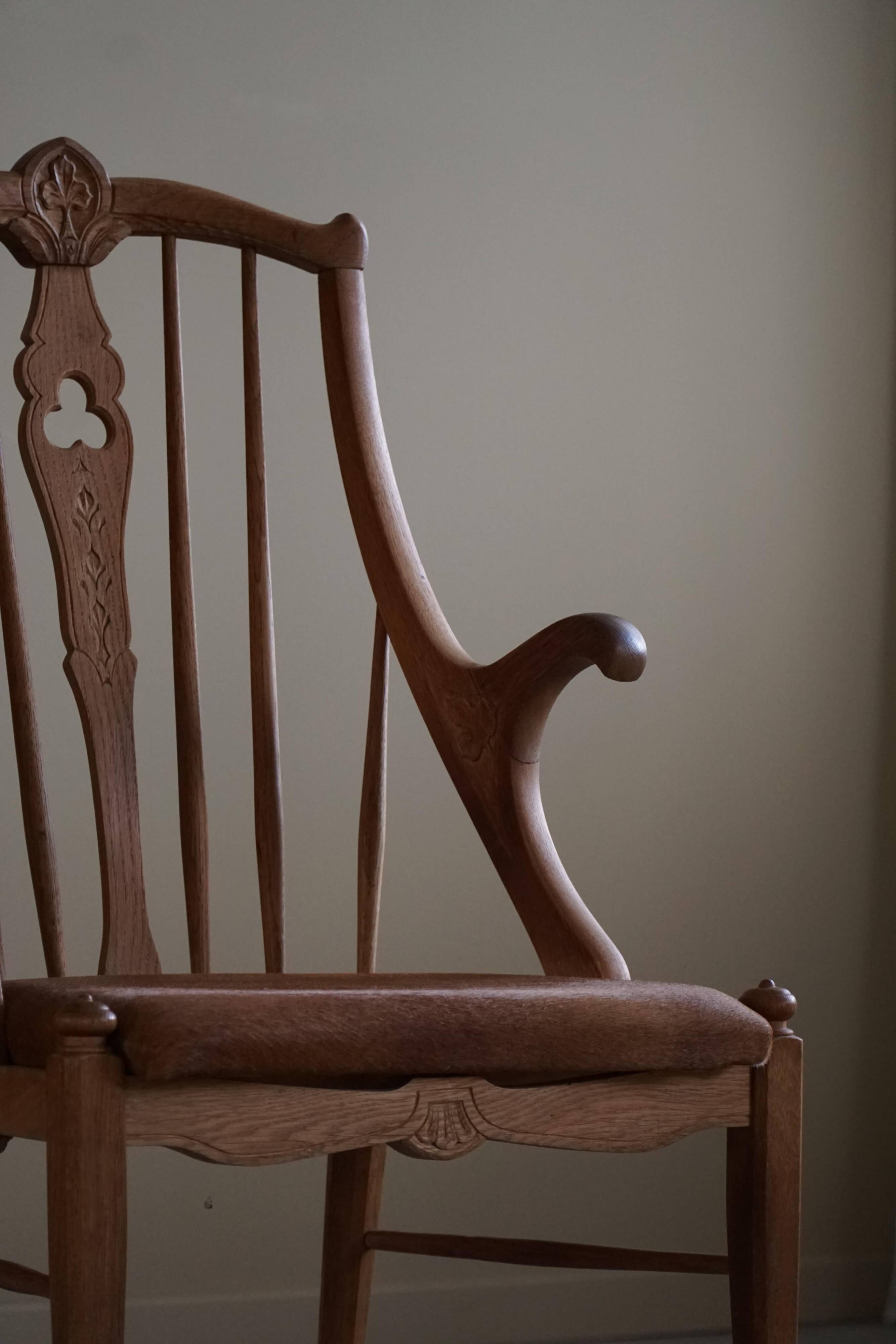Danish high-back armchair in solid oak with leather cushion, mid-century, 1950s.