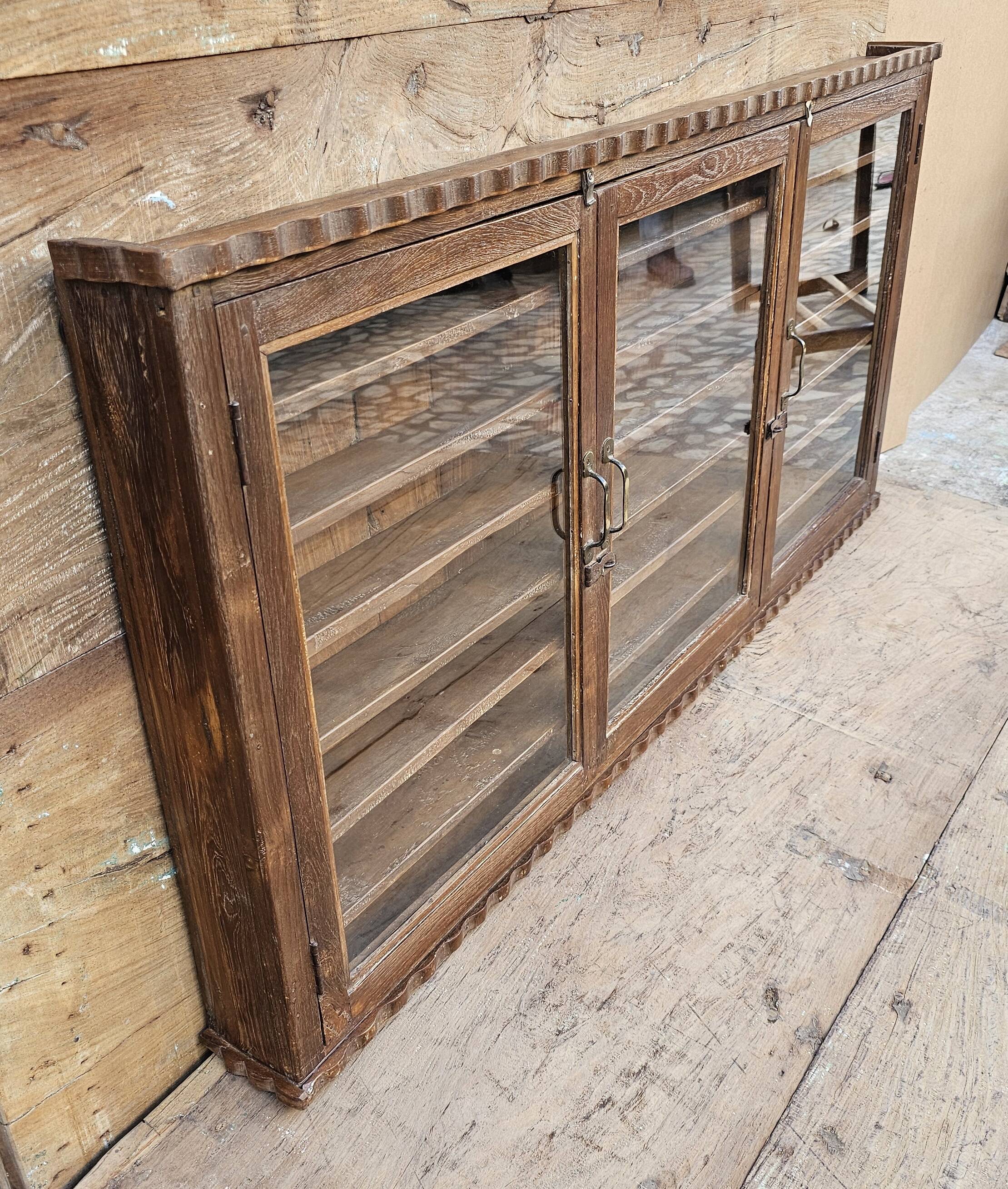 Antique Burmese teak collector's wall display case