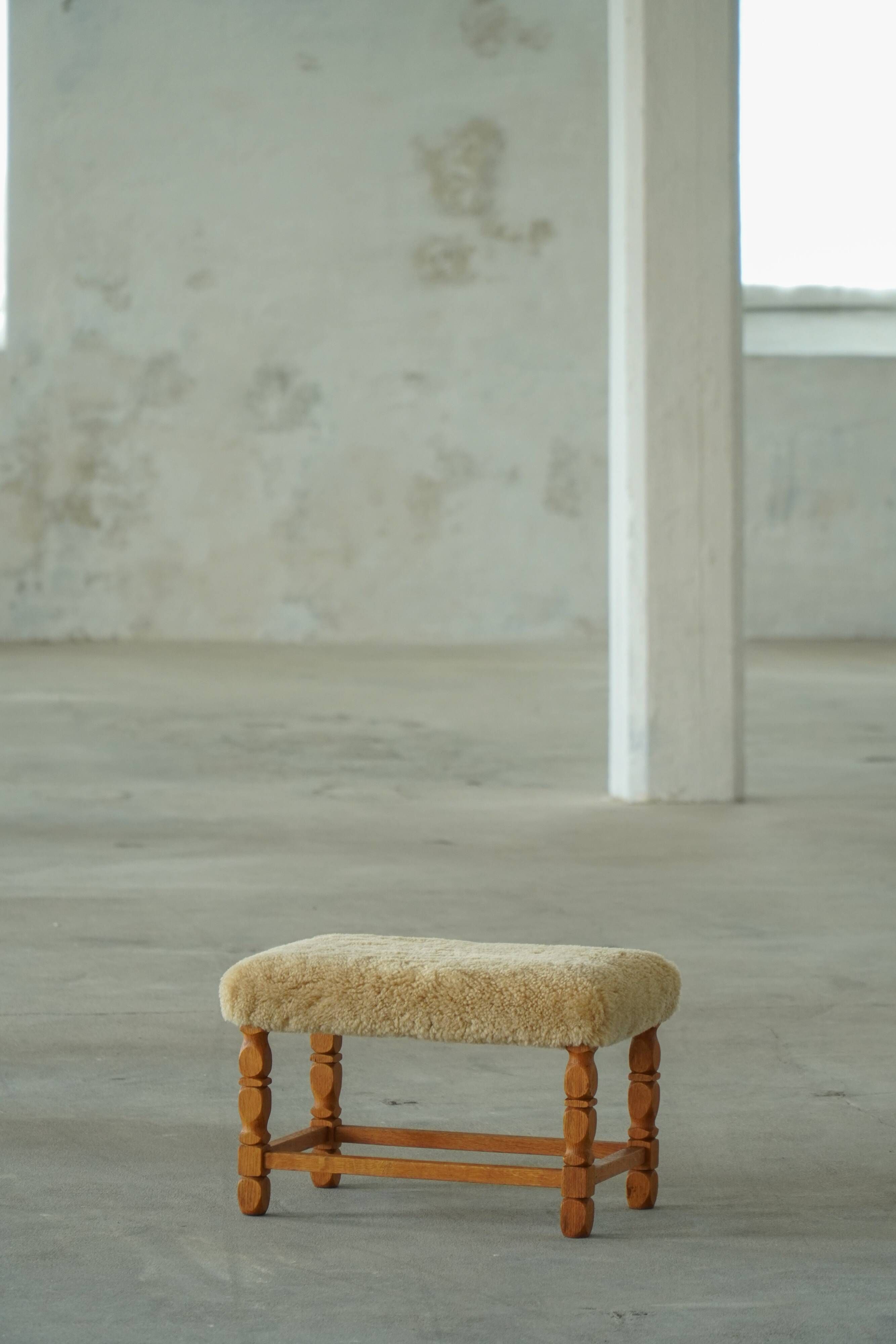 Rectangular oak stool, reupholstered in lambswool, Danish cabinetmaker, 1960.